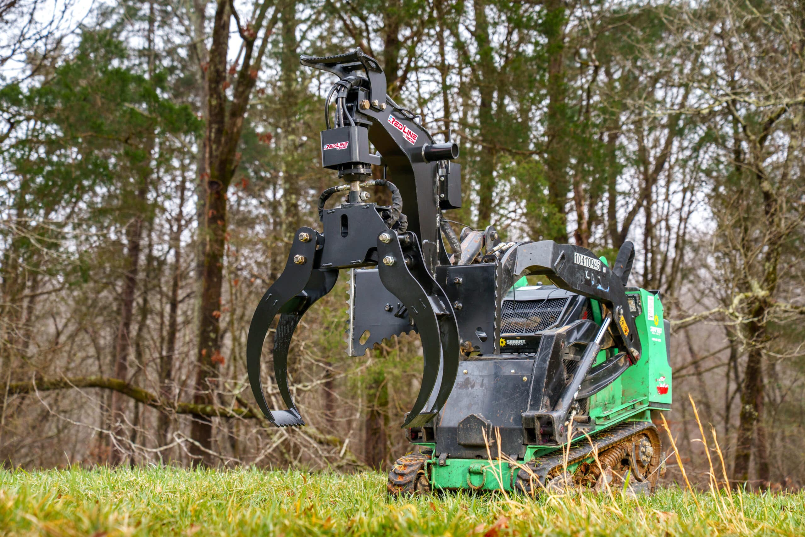 Fecon Red Line LG57 log grapple on a mini skid steer